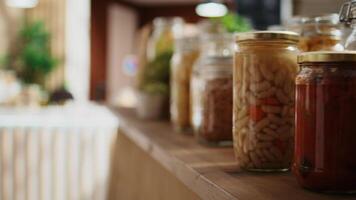 Close up shot of preservatives free pantry staples on zero waste supermarket shelves. Organic food in nonpolluting reusable glass containers on display in empty local neighborhood grocery store video