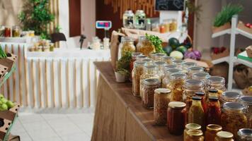 Additives free pantry staples on eco friendly zero waste supermarket shelves. Organic food in biodegradable reusable glass jars on display in empty local neighborhood grocery store video