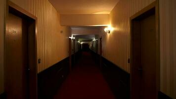 POV footage walking in poorly lit hotel hall. Halloween and terror. Horror and scary video