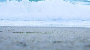 Low angle of waves on the beach in slow motion video