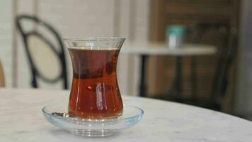Traditional turkish tea on white table . video