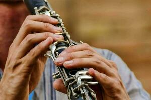 a man is playing the clarinet photo