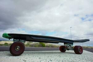 a skateboard with wheels on the ground photo