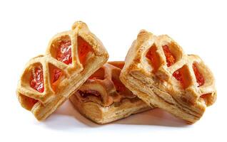 Puff pastry pastry with lingonberry jam isolated on a white background. Cookies with lingonberry jam. photo