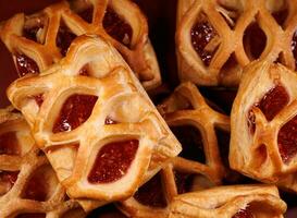 Background of cookies with lingonberry jam. Cookies with lingonberry jam. photo