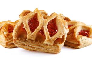 Puff pastry pastry with lingonberry jam on a white background. Cookies with lingonberry jam. photo