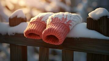 ai generativo mitones, nieve guantes en el nieve en temprano Mañana luz de sol foto