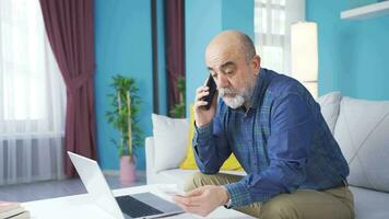 Confused old man looking at overpriced bill. video