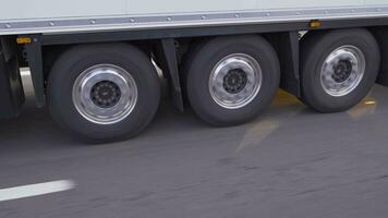 Wheels of truck moving on highway. video