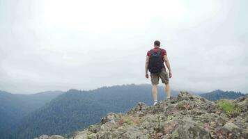 The man walking on the summit.  Feeling of freedom. video