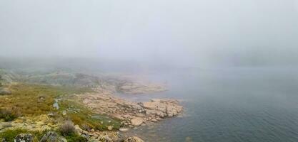 Idyllic landscape of a lagoon in a foggy environment photo