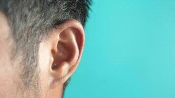 Left ear of young men. Problem of perception, deafness, hear concept. video