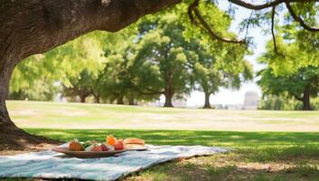 Picnic in the park with fruits on a plaid and a large tree. AI Generated. photo