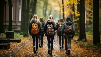 Group of young women with backpacks walking through the autumn park. AI Generated. photo