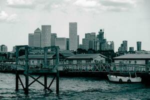 Canary Wharf view behind Wapping Pier in London photo