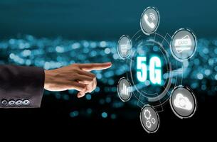 Global communication network concept, Person hand touching 5G icon on virtual screen with blue bokeh background, World wide business, high-speed mobile Internet, new generation networks. Mixed media. photo