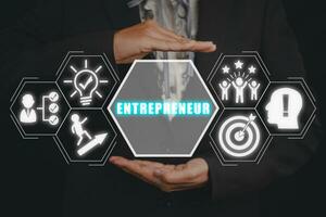 Entrepreneur concept, Business woman hand holding entrepreneur icon on virtual screen. photo