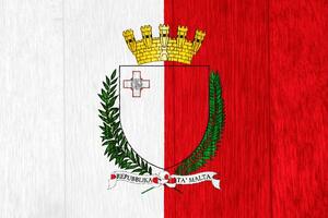 Flag and coat of arms of Republic of Malta on a textured background. Concept collage. photo