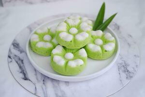 Kue Putu Ayu, a traditional Indonesian snack made from rice flour, pandan leaves, grated coconut then steamed. photo