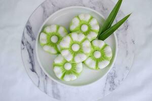 Kue Putu Ayu, a traditional Indonesian snack made from rice flour, pandan leaves, grated coconut then steamed. photo