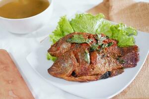 Fried mackerel fish with chili sauce photo