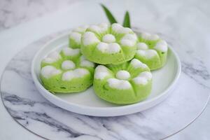 Kue Putu Ayu, a traditional Indonesian snack made from rice flour, pandan leaves, grated coconut then steamed. photo