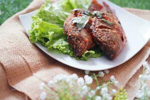 Fried mackerel fish with chili sauce photo