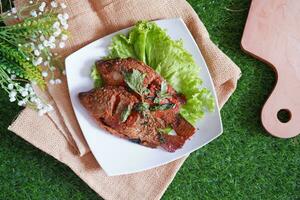 Fried mackerel fish with chili sauce photo