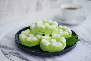 Kue Putu Ayu, a traditional Indonesian snack made from rice flour, pandan leaves, grated coconut then steamed. photo