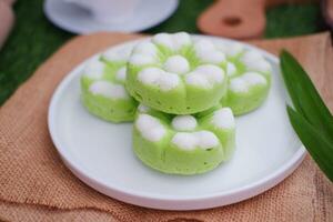 Kue Putu Ayu, a traditional Indonesian snack made from rice flour, pandan leaves, grated coconut then steamed. photo