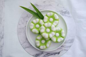 Kue Putu Ayu, a traditional Indonesian snack made from rice flour, pandan leaves, grated coconut then steamed. photo