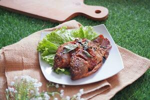 Fried mackerel fish with chili sauce photo