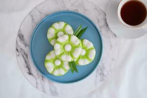 Kue Putu Ayu, a traditional Indonesian snack made from rice flour, pandan leaves, grated coconut then steamed. photo