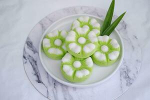 Kue Putu Ayu, a traditional Indonesian snack made from rice flour, pandan leaves, grated coconut then steamed. photo