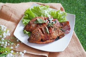 Fried mackerel fish with chili sauce photo