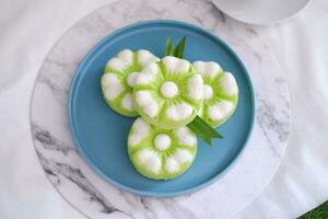 Kue Putu Ayu, a traditional Indonesian snack made from rice flour, pandan leaves, grated coconut then steamed. photo