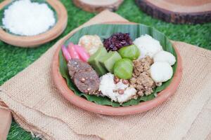 Jenang Madura is a typical Indonesian food that consists of black sticky rice, porridge marrow, jenang grendul and red pearls that were given palm sugar and coconut milk photo