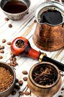 Smoking pipe and coffee photo