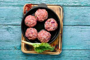 Fresh raw meat balls photo