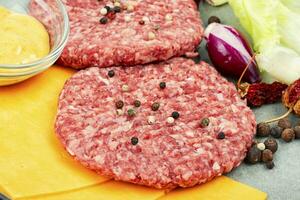 Raw burger cutlets photo