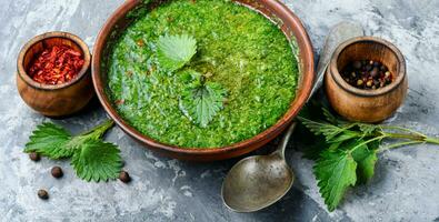 Stringing nettle soup photo