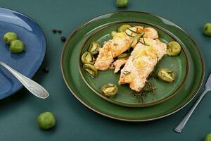 Roasted salmon fillet steak with mini kiwi. photo