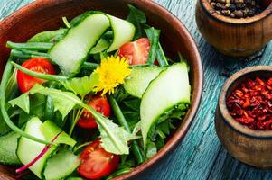 Spring salad with dandelions photo