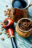 Smoking pipe and coffee photo