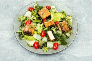 Salad with fresh vegetables and tofu. photo