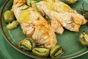 Baked salmon fillets with mini kiwi. photo