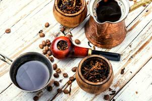 Smoking pipe and coffee photo