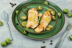 Baked salmon fish fillet with mini kiwi. photo