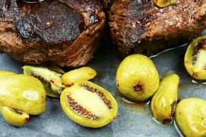 Grilled ostrich steak with kiwi sauce photo