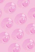 a pink background with many bubbles on it photo